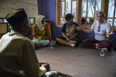 May Boeve, founder of 350.org - a non-profit organization focus on climate change from US, talks with local communities who sufferring from coal power plants in Kanci village, Cirebon regency, West Java province on 24 January 2017. "Agriculture productivity gets lower and unemployments are everywhere since productive lands got evicted, the dust from the coal also give bad impact to the locals' health," said locals. Photo by Ardiles Rante for 350.org