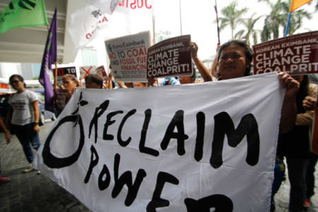 Filipino climate justice activists protested today, October 11, 2016, in front of the local headquarters of the Export­Import Bank of Korea (KEXIM), in Makati City, demanding that it stop funding fossil fuel projects worldwide and be banned from receiving climate funding. The activists are part of 350.org, a global climate movement which co­signed a civil society letter demanding that the GCF board exclude export credit agencies such as KEXIM from accreditation. The demonstration was also part of Reclaim Power, a global month of action aimed at institutions funding dirty energy projects that fuel climate change.