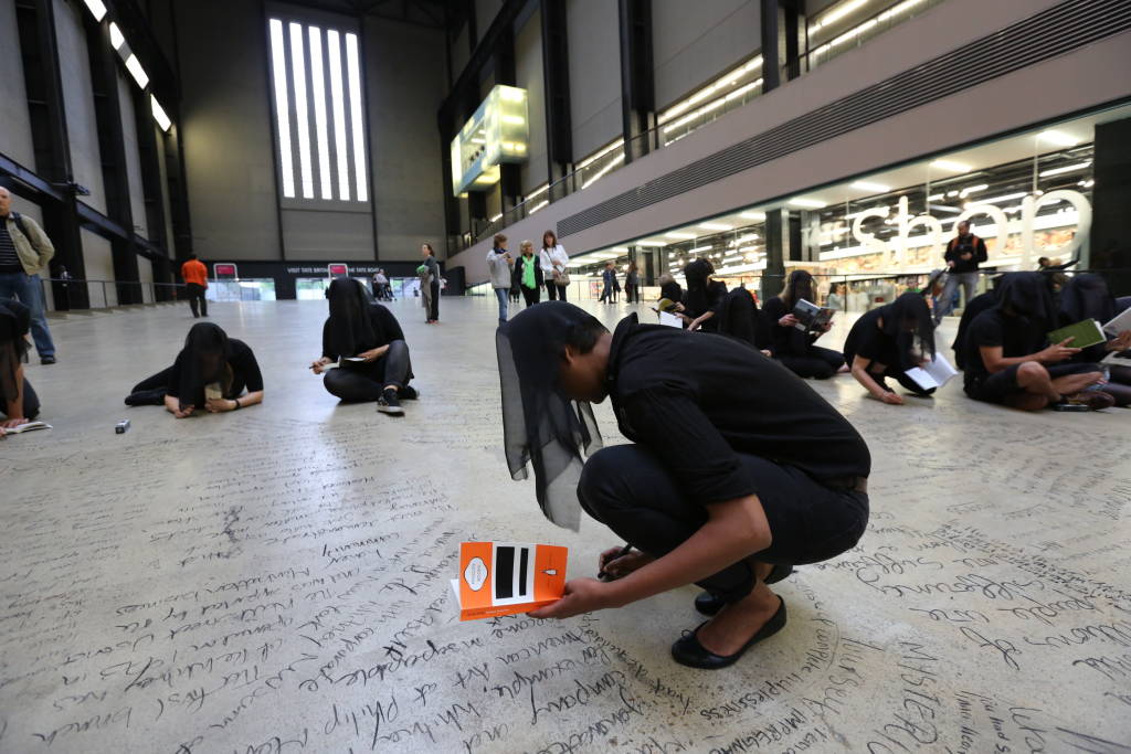 Arts collective Liberate Tate occupy Tate Modern's Turbine Hall an unsanctioned 25-hour performance in June 2015, writing messages about climate change, oil, and art. In March 2016, it was revealed that the Tate/BP sponsorship deal would end. Photo by Liberate Tate