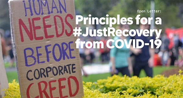 A sign reads human needs before corporate greed with a title saying Principles for a Just Recovery from COVID-19